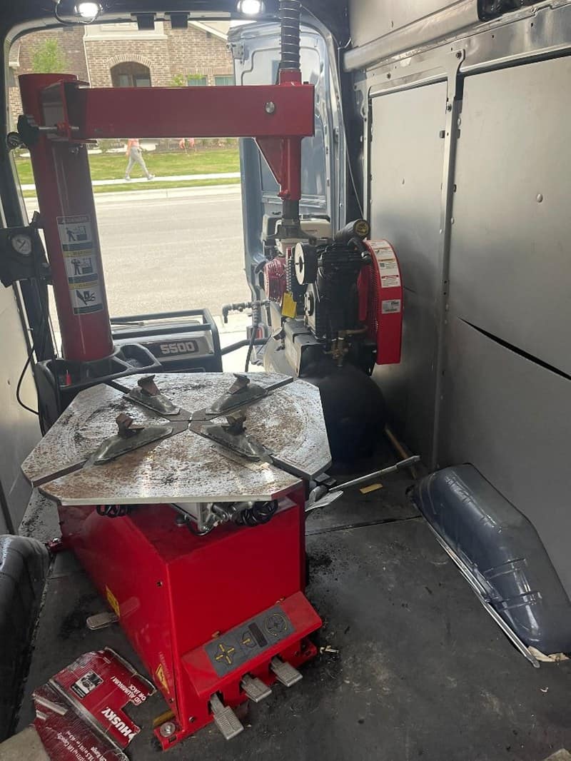 Tire changer machine inside mobile unit